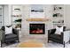Cozy living room with a stone fireplace and built-in shelving at 1001 Cody Bluffs Rd, Babson Park, FL 33827