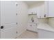 Bright laundry room featuring white cabinets and a clean design at 1001 Cody Bluffs Rd, Babson Park, FL 33827