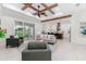 Open-concept living space with a view into the kitchen and access to the backyard at 1001 Cody Bluffs Rd, Babson Park, FL 33827