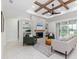 Living room with a fireplace, high ceilings, and sliding doors leading to the backyard at 1001 Cody Bluffs Rd, Babson Park, FL 33827