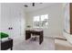 Bright home office features built-in shelving and window views at 1001 Cody Bluffs Rd, Babson Park, FL 33827