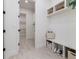 Bright laundry room with built-in shelving and bench at 1001 Cody Bluffs Rd, Babson Park, FL 33827