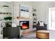 Cozy living room featuring a stone fireplace, built-in shelves, and comfortable seating at 1001 Cody Bluffs Rd, Babson Park, FL 33827