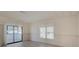 Light and airy dining room with sliding glass doors leading to a sunroom at 2211 Harbor Town Ln, Lakeland, FL 33810