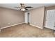 Bedroom with ceiling fan, closet, and carpet floor at 3445 Ewell Rd, Lakeland, FL 33811