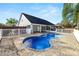 Aerial view of the freeform pool, patio, and home at 3445 Ewell Rd, Lakeland, FL 33811