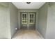 Inviting front entry with double doors and sidelights at 4969 Lake Pierce Dr, Lake Wales, FL 33898