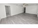 Large bedroom with gray wood-look flooring and access to en-suite bathroom at 4969 Lake Pierce Dr, Lake Wales, FL 33898