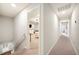 Upstairs hallway with carpet and access to bedrooms at 5009 Hanover Ln, Lakeland, FL 33813