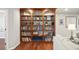 Built-in wooden bookshelves filled with various books and decor at 5009 Hanover Ln, Lakeland, FL 33813