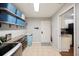 Laundry room with built-in shelving, a utility sink, and additional storage at 5009 Hanover Ln, Lakeland, FL 33813