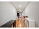 Long hallway with ample storage space and light wood flooring at 5009 Hanover Ln, Lakeland, FL 33813