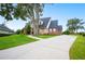 Beautiful two-story home with a manicured lawn and driveway at 5009 Hanover Ln, Lakeland, FL 33813