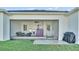 Relaxing screened patio with seating area, ceiling fan, and grill at 570 Gandhi Dr, Lakeland, FL 33813