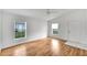 Living room with hardwood flooring and multiple windows at 6064 Mission Dr, Lakeland, FL 33812