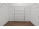 Large closet with wire shelving, providing ample storage space at 618 Ridge Ter, Winter Haven, FL 33881
