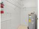 Storage room with shelving and water heater at 618 Ridge Ter, Winter Haven, FL 33881