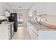 Bright kitchen with white cabinets and appliances at 618 Ridge Ter, Winter Haven, FL 33881
