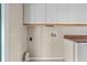 Laundry area with washer, dryer, cabinets, and shelving at 618 Ridge Ter, Winter Haven, FL 33881