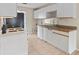 Efficient kitchen with white cabinets and tiled floor at 618 Ridge Ter, Winter Haven, FL 33881