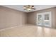 Spacious bedroom with tile flooring and double doors leading to patio at 618 Ridge Ter, Winter Haven, FL 33881