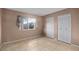Bright bedroom with tile floors and double door closet at 618 Ridge Ter, Winter Haven, FL 33881