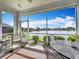 Relaxing screened porch with lake view, perfect for outdoor dining at 6614 Englelake Dr, Lakeland, FL 33813