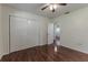 Spacious bedroom with wood flooring, double closets and an adjoining bathroom at 311 Wildwood Ave, Lakeland, FL 33809