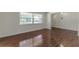 Bright living room with hardwood floors and large windows at 311 Wildwood Ave, Lakeland, FL 33809