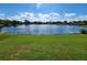 Serene lake view with lush greenery and tranquil waters at 6614 Englelake Dr, Lakeland, FL 33813