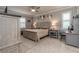 Spacious main bedroom with a large bed and plenty of natural light at 7929 Lake James Blvd, Lakeland, FL 33810