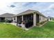 Screened patio, grill, and spacious grassy backyard at 7929 Lake James Blvd, Lakeland, FL 33810