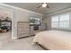 Main bedroom with large TV, fireplace, and built in dresser at 7929 Lake James Blvd, Lakeland, FL 33810