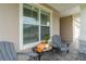 Cozy front porch with rocking chairs and fall decor at 7929 Lake James Blvd, Lakeland, FL 33810