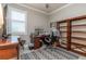 Bright home office features built-in shelving and wood desk at 7929 Lake James Blvd, Lakeland, FL 33810