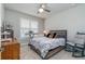 Guest bedroom with rocking chair and window shutters at 7929 Lake James Blvd, Lakeland, FL 33810