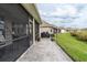 Extended patio with seating area and grill at 7929 Lake James Blvd, Lakeland, FL 33810