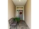 Inviting entryway with a bench and fall wreath at 7929 Lake James Blvd, Lakeland, FL 33810