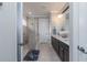 Elegant bathroom with double vanity, granite countertop, and large walk-in shower at 7929 Lake James Blvd, Lakeland, FL 33810