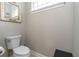 Small bathroom with toilet and single sink vanity at 7929 Lake James Blvd, Lakeland, FL 33810