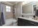 Well-appointed bathroom with soaking tub, dark vanity, and stylish tile at 7929 Lake James Blvd, Lakeland, FL 33810