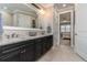 Spacious bathroom with double vanity and view of bedroom at 7929 Lake James Blvd, Lakeland, FL 33810