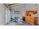 Bright living area with teal sofa and wood beam ceiling at 1 Loma Linda, Lakeland, FL 33813