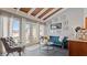 Living room features a teal sofa and wood beam ceiling at 1 Loma Linda, Lakeland, FL 33813