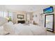 Main bedroom with king-size bed and access to private balcony at 1 Loma Linda, Lakeland, FL 33813