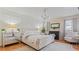 Luxurious main bedroom with a king-size bed and elegant decor at 1 Loma Linda, Lakeland, FL 33813