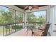 Private screened balcony with seating and tranquil view at 1 Loma Linda, Lakeland, FL 33813