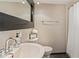 Updated bathroom with a pedestal sink and shower at 1 Loma Linda, Lakeland, FL 33813