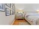 Well-lit bedroom with mirrored dresser and hardwood floors at 1 Loma Linda, Lakeland, FL 33813