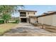 Two-story townhome with private driveway and grassy yard at 1 Loma Linda, Lakeland, FL 33813